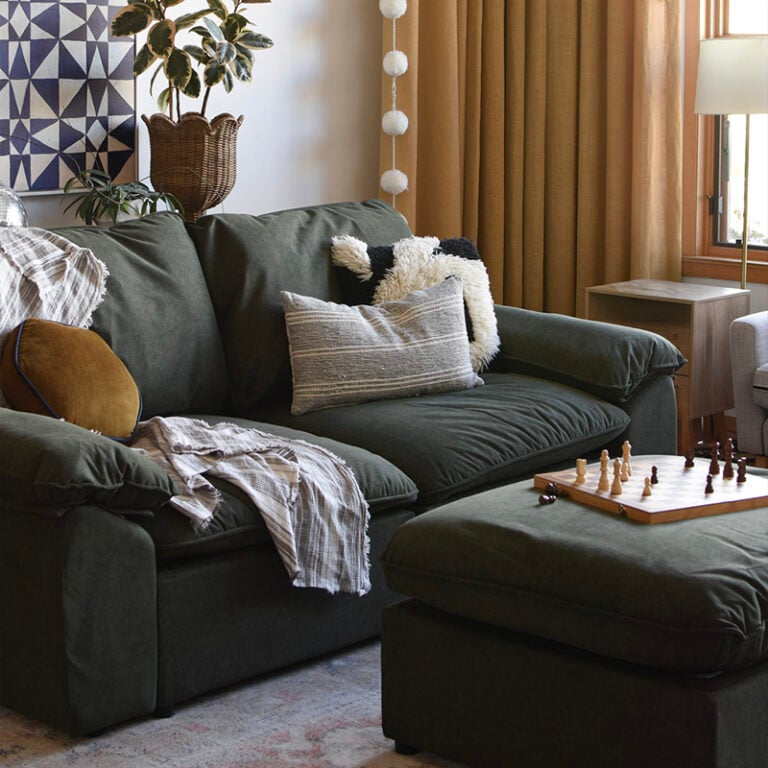 1 - Green modular sofa - family chess game on ottoman