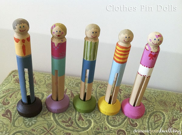 Learn how to make custom DIY Clothes Pin Dolls. A special custom present for a new baby or even adoption.  The perfect baby shower gift idea. Delineate Your Dwelling #clothespindolls