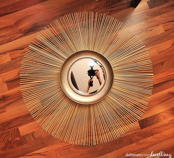 Wooden Skewer Sunburst Mirror on floor
