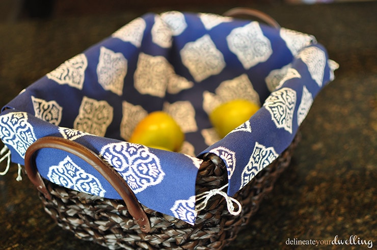 No Sew Basket Liners Learn how to line a basket with fabric without any sewing skills needed! Follow these simple instructions and step by step instructions on how to take a wicker basket and make DIY basket liners with no sewing involved. Delineate Your Dwelling #nosewbasketliner #nosewproject #basketliner