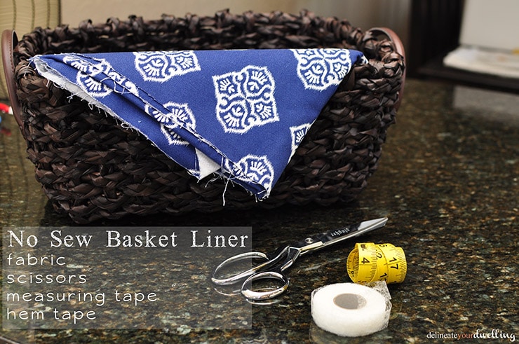 Learn how to line a basket with fabric without any sewing skills needed! Follow these simple instructions and step by step instructions on how to take a wicker basket and make DIY basket liners with no sewing involved. Delineate Your Dwelling #nosewbasketliner #nosewproject #basketliner