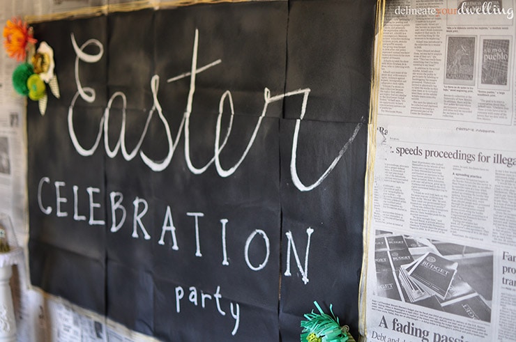 Learn how to make a gorgeous and unique backdrop for any party!  Create a newspaper chalkboard wall and celebrate in style. Delineate Your Dwelling #partybackdrop #DIYbackdrop #newspapercraft