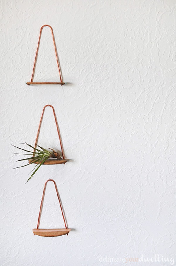 Simple and mini Copper pipe shelves. Fun to make and perfect to hold small decor on your wall. | Delineate Your Dwelling