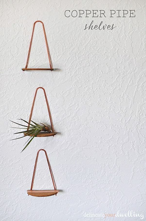 Learn how to create simple but goregous Copper Pipe Shelves using just a few easy materials! You can DIY these small shelves in under an hour.  Fun to make and perfect to hold small decor on your wall. Delineate Your Dwelling