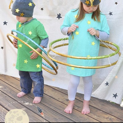 Easy to Make Planet Halloween Costumes with hula hoops, Delineate Your Dwelling