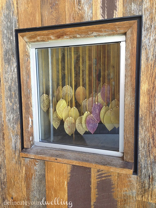 Learn how to make these simple DIY leaf press leaves for a fun autumn hanging display, inspired and created during an Anthropologie window workshop.  Delineate Your Dwelling #anthrowindow #anthropologiewindow