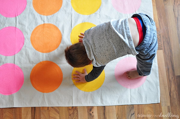 Learn how to make a custom homemade DIY Twister mat and board game for your next birthday party.  Plan to have loads of good ole' fashioned family fun with your kids! Delineate Your Dwelling #DIYTwister #DIYTwisterMat #DIYTwisterboard