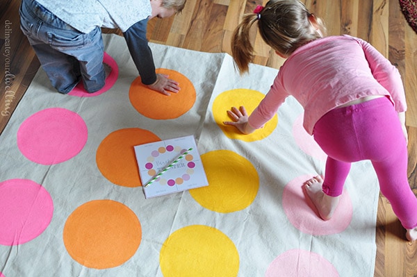 Learn how to make a custom homemade DIY Twister mat and board game for your next birthday party.  Plan to have loads of good ole' fashioned family fun with your kids! Delineate Your Dwelling #DIYTwister #DIYTwisterMat #DIYTwisterboard