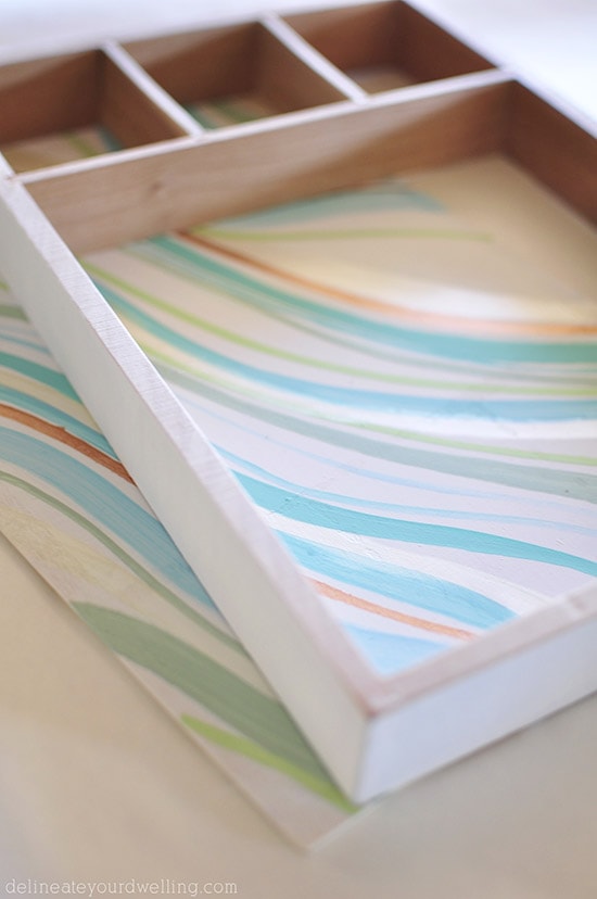 Learn how to create a statement marbled piece using simple acrylic paint and an old wooden toy container. In just a few steps you'll be painting your own Marbled Wall Shadow Box. Delineate Your Dwelling #paintedshadowbox #DIYshadowbox