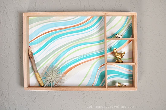 Learn how to create a statement marbled piece using simple acrylic paint and an old wooden toy container. In just a few steps you'll be painting your own Marbled Wall Shadow Box. Delineate Your Dwelling #paintedshadowbox #DIYshadowbox