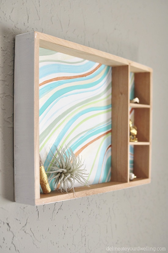 Learn how to create a statement marbled piece using simple acrylic paint and an old wooden toy container. In just a few steps you'll be painting your own Marbled Wall Shadow Box. Delineate Your Dwelling #paintedshadowbox #DIYshadowbox