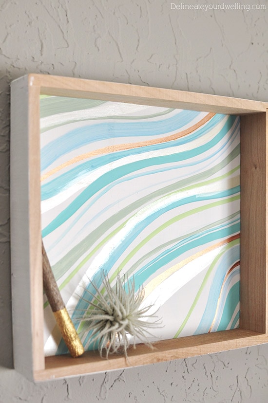 Learn how to create a statement marbled piece using simple acrylic paint and an old wooden toy container. In just a few steps you'll be painting your own Marbled Wall Shadow Box. Delineate Your Dwelling #paintedshadowbox #DIYshadowbox