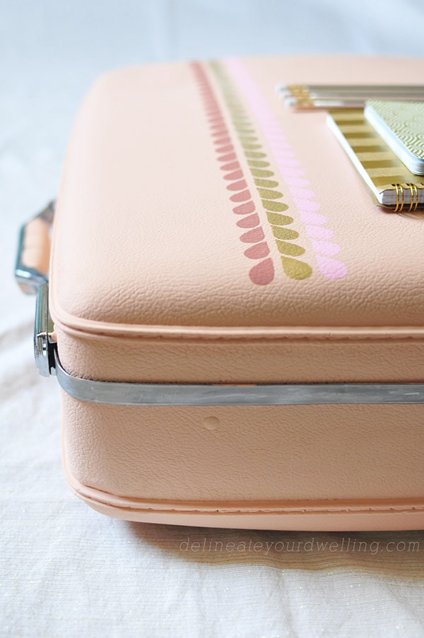 Learn how to transform an old suitcase piece into an Easy DIY Hand Painted Luggage statement!  A quick and easy colorful update will give your travels a whole new look. Delineate Your Dwelling #paintedluggage #paintsuitcase