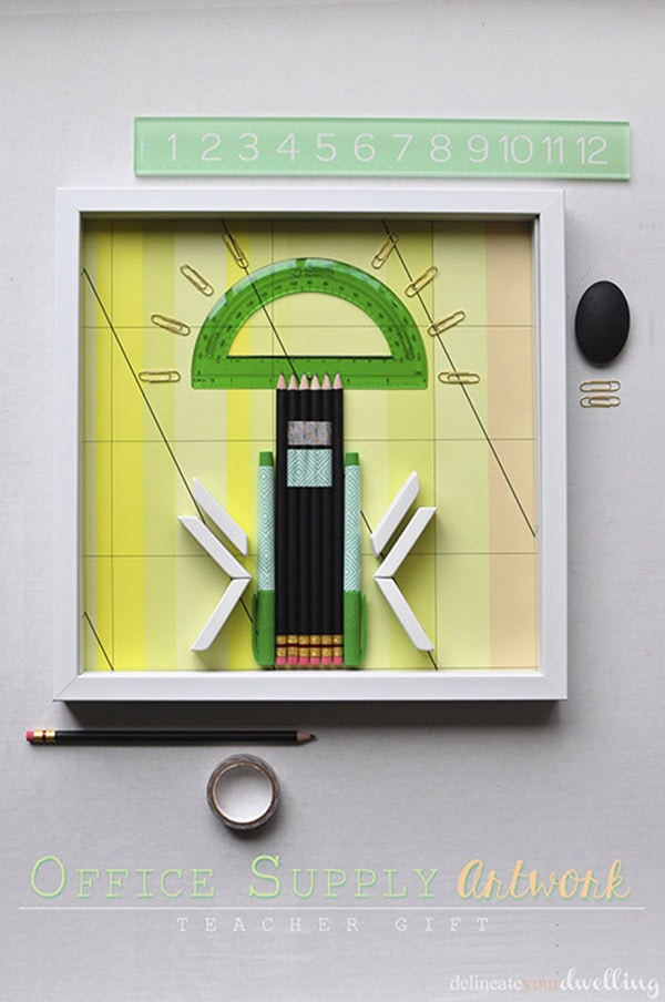 Learn how to use office supplies and transform them into shadowbox DIY artwork! Perfect to hang in your office or to even make with your kids to kick off the new school year. Delineate Your Dwelling #teachergift #DIYshadowbox