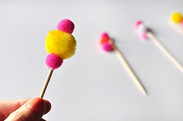Glued Pom Pom on a wooden skewer