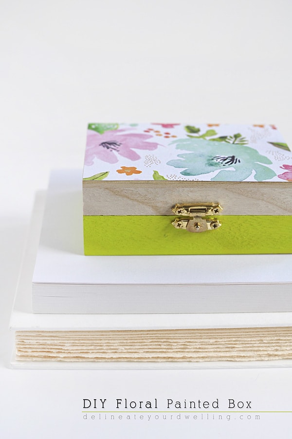 Learn how to create a DIY floral painted wooden box using whimsical scrapbook paper! A simple statement piece for any room in your home. Delineate Your Dwelling #paintedbox #scrapbookpaperbox