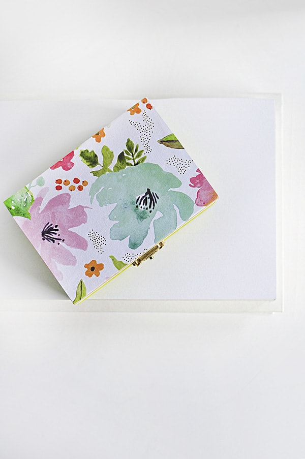 Learn how to create a DIY floral painted wooden box using whimsical scrapbook paper! A simple statement piece for any room in your home. Delineate Your Dwelling #paintedbox #scrapbookpaperbox