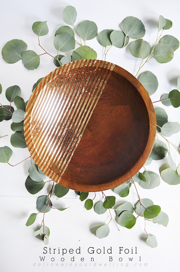 Learn how to create an elegant and unique Striped Gold Foil Wooden Bowl. The perfect DIY project to add a little drama to any piece. Delineate Your Dwelling #goldfoilbowl #goldfoil