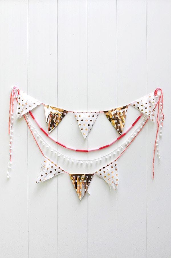 Learn how to make a Tissue Paper Banner as a fun DIY party decor item! See the quick steps to help add festive wonder to your next party while using tissue paper. Delineate Your Dwelling #tissuepaperbanner #tissuepapercraft #paperbanner