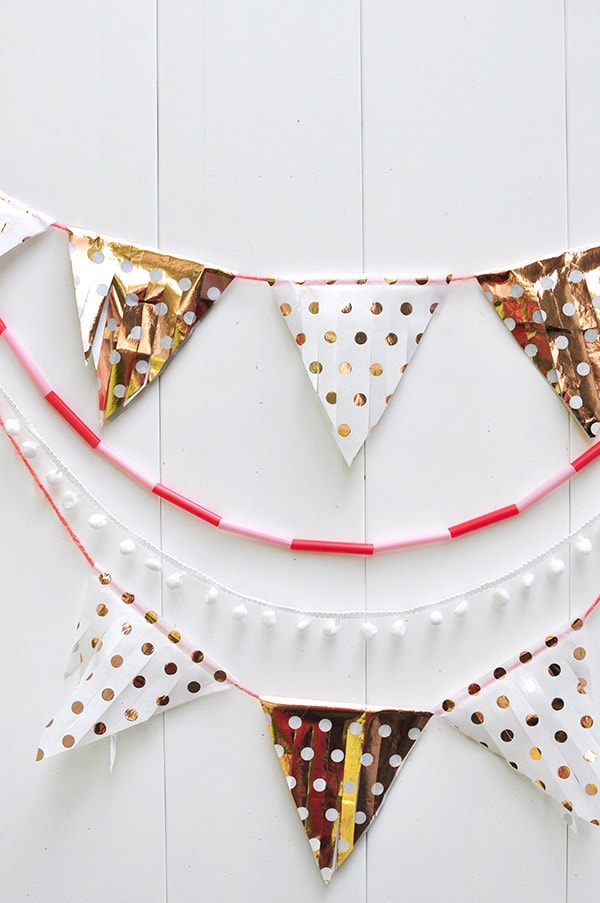 Learn how to make a Tissue Paper Banner as a fun DIY party decor item! See the quick steps to help add festive wonder to your next party while using tissue paper. Delineate Your Dwelling #tissuepaperbanner #tissuepapercraft #paperbanner