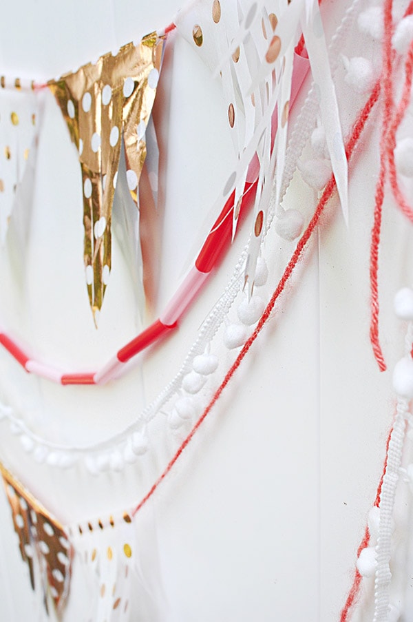 Learn how to make a Tissue Paper Banner as a fun DIY party decor item! See the quick steps to help add festive wonder to your next party while using tissue paper. Delineate Your Dwelling #tissuepaperbanner #tissuepapercraft #paperbanner