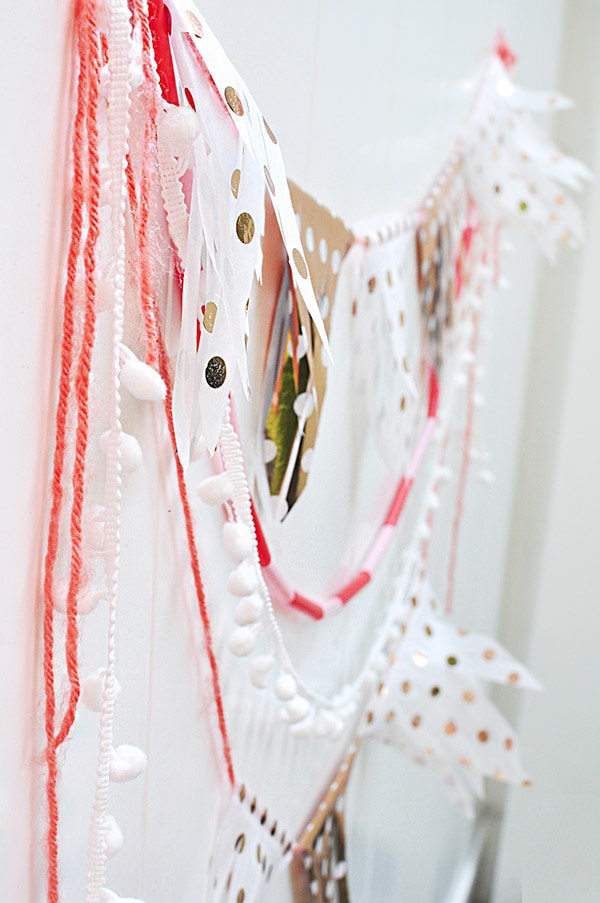 Learn how to make a Tissue Paper Banner as a fun DIY party decor item! See the quick steps to help add festive wonder to your next party while using tissue paper. Delineate Your Dwelling #tissuepaperbanner #tissuepapercraft #paperbanner