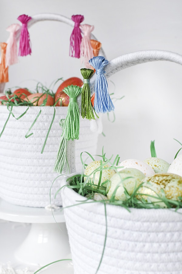 First, learn how to make tassels using Embroidery Floss. Then apply those tassels to any type of basket, making a simple and fun DIY Tassel Easter Basket for Easter this year! Delineate Your Dwelling #easterbasketDIY #tasselbasket #DIYEasterBasket #DIYEaster
