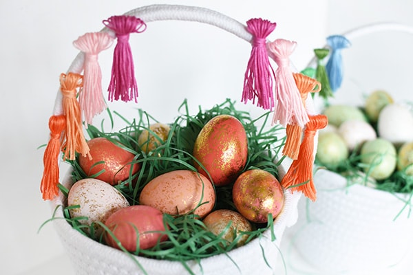 First, learn how to make tassels using Embroidery Floss. Then apply those tassels to any type of basket, making a simple and fun DIY Tassel Easter Basket for Easter this year! Delineate Your Dwelling #easterbasketDIY #tasselbasket #DIYEasterBasket #DIYEaster