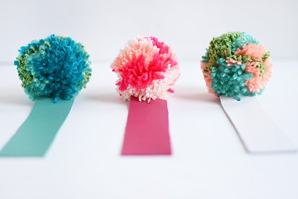 Simple DIY Leather Pom Pom Bookmarks, perfect for kids and adults alike! Delineate Your Dwelling