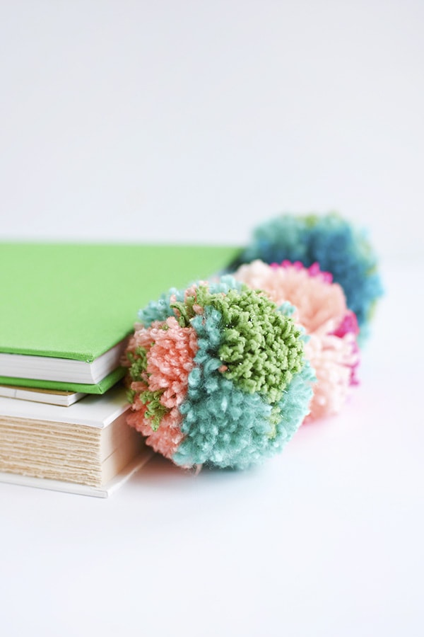 Simple DIY Leather Pom Pom Bookmarks, perfect for kids and adults alike! Delineate Your Dwelling