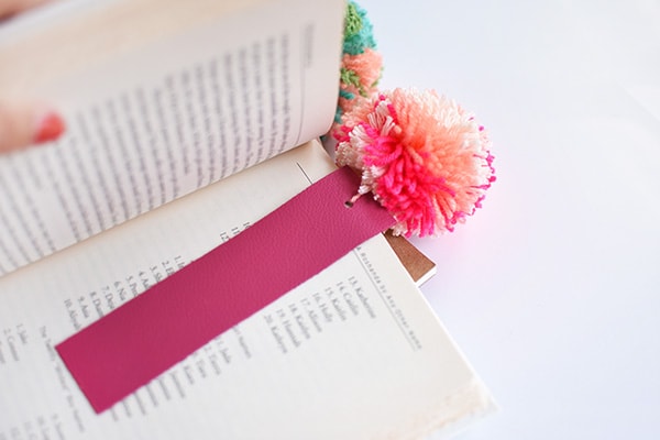 Simple DIY Leather Pom Pom Bookmarks, perfect for kids and adults alike! Delineate Your Dwelling