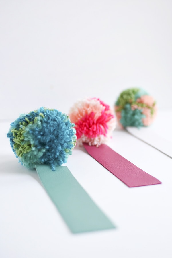 Simple DIY Leather Pom Pom Bookmarks, perfect for kids and adults alike! Delineate Your Dwelling