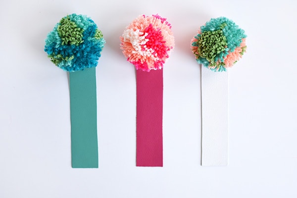 Simple DIY Leather Pom Pom Bookmarks, perfect for kids and adults alike! Delineate Your Dwelling