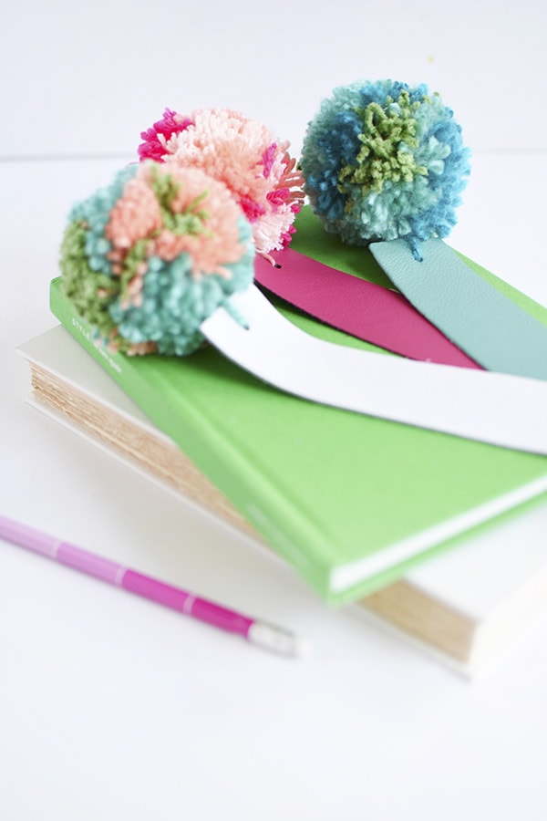 Simple DIY Leather Pom Pom Bookmarks, perfect for kids and adults alike! Delineate Your Dwelling