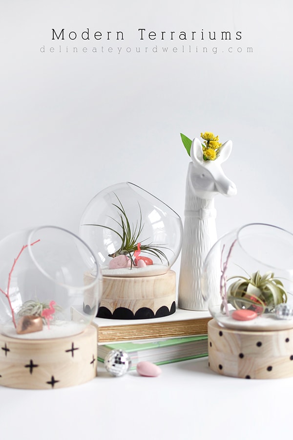 A modern take on a traditional plant terrarium! Painted Crosses, Scallops and Polka Dots add the perfect pattern to the wood base.  Learn how to create this trendy DIY using air plants, disco balls and mini flamingos. Delineate Your Dwelling #modernterrarium #airplantterrarium