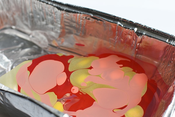 Nail polish in a tin container