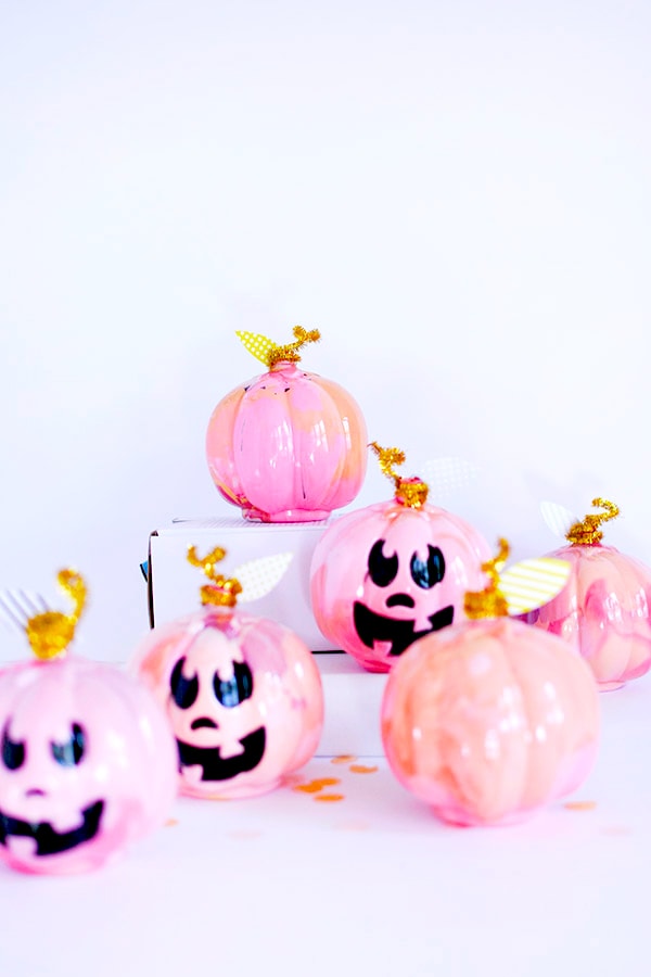 Fun and festive DIY Pink Marbled Pumpkins! Perfect for a table setting or placing on your fireplace mantel during the Fall Season. Delineate Your Dwelling