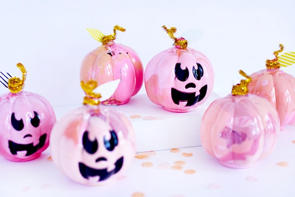 Fun and festive DIY Pink Marbled Pumpkins! Perfect for a table setting or placing on your fireplace mantel during the Fall Season. Delineate Your Dwelling