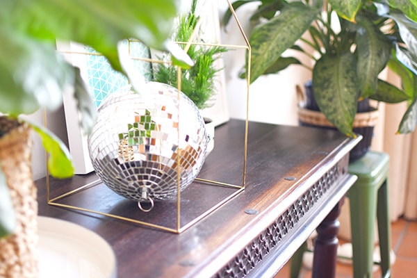 Reasons why you need a Disco Ball in your everyday home decor! Plus, ways to use different sized disco balls, the history behind them and a disco ball shopping resource. Delineate Your Dwelling #discoball #discoballhome #discoballdecor