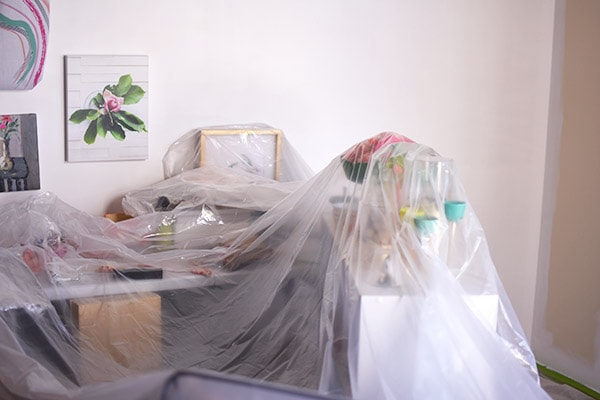 Furniture covered in painter's plastic