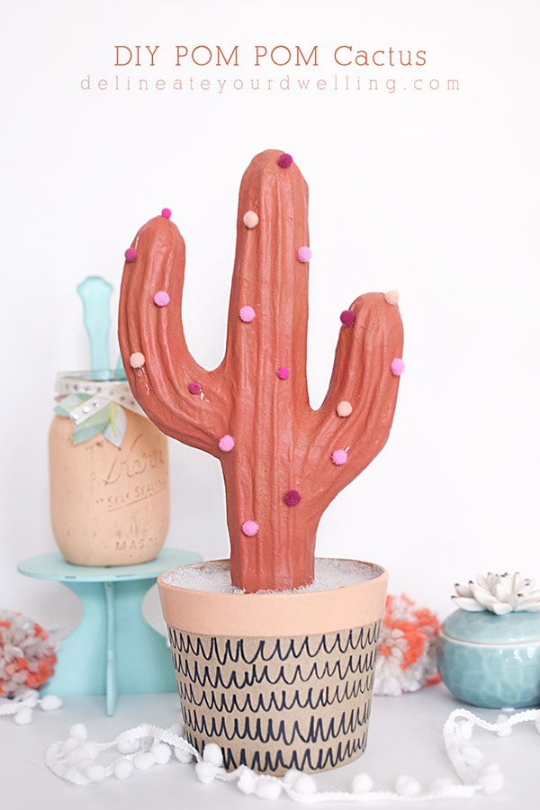 Add fun color and whimsy to your home with a Potted Pom Pom Cactus craft! A modern take on any plant and best for the plant lover and black thumb! Delineate Your Dwelling #pompomcraft #cactuscraft #plantcraft