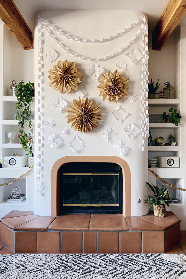 Gorgeous paper snowflakes on a Holiday Fireplace