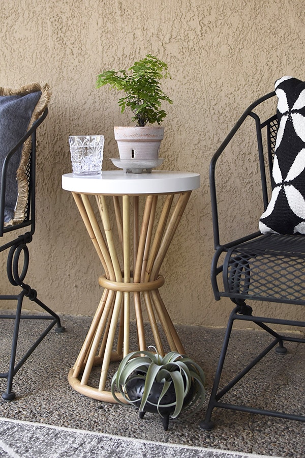 Easy Back Patio refresh, Rattan Side Table - Easy Back Patio refresh, Check out 5 simple tips for updating your outdoor space.  Learn how to get your concrete patio summer ready in no time at all! Delineate Your Dwelling #patioideas #patiodecoratingideas