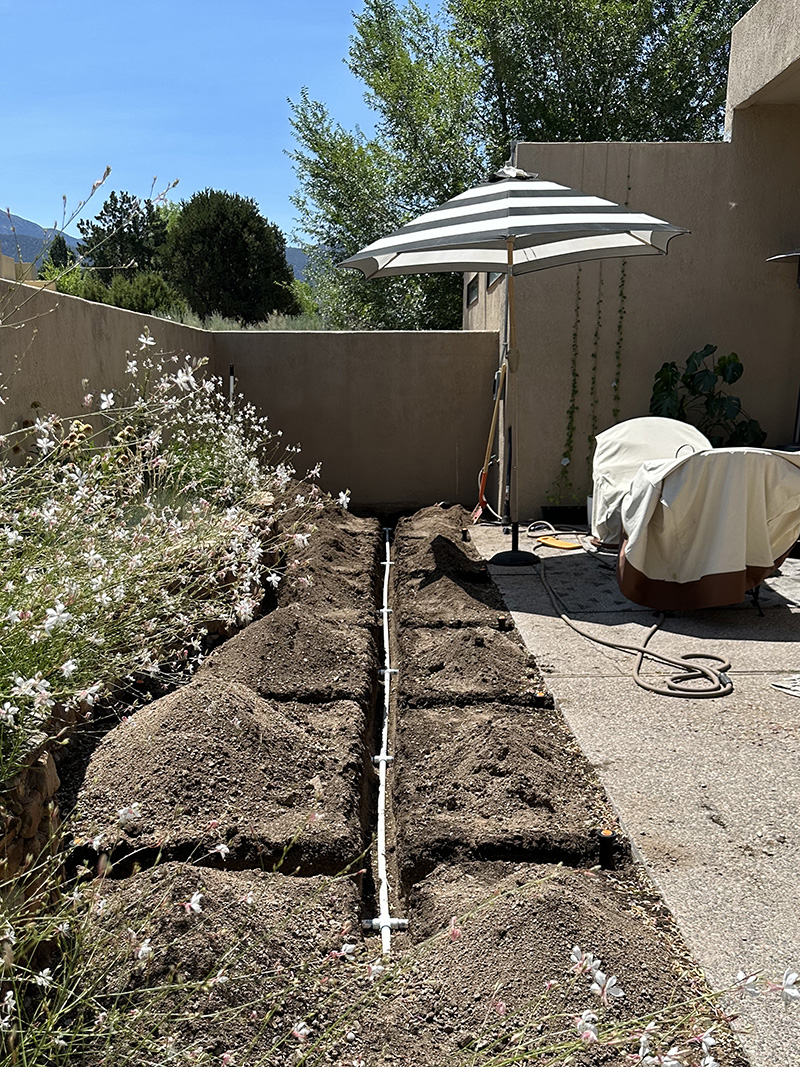 Trenched irrigation lateral pipes
