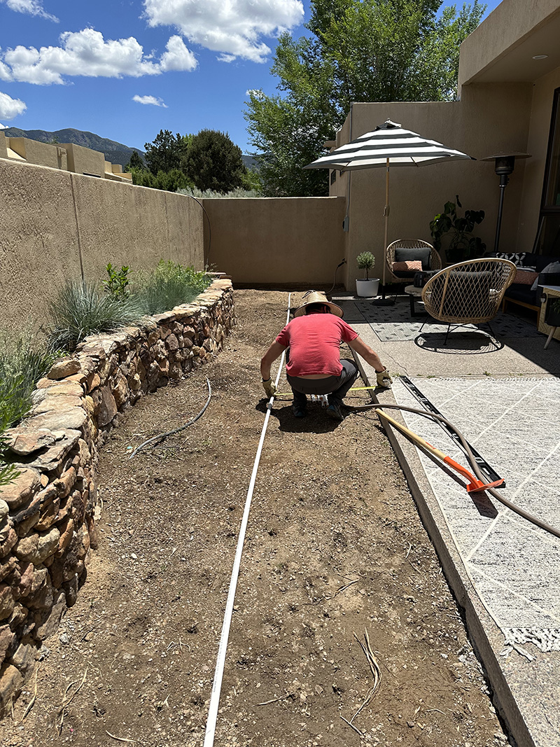 Laying out irrigation pipe