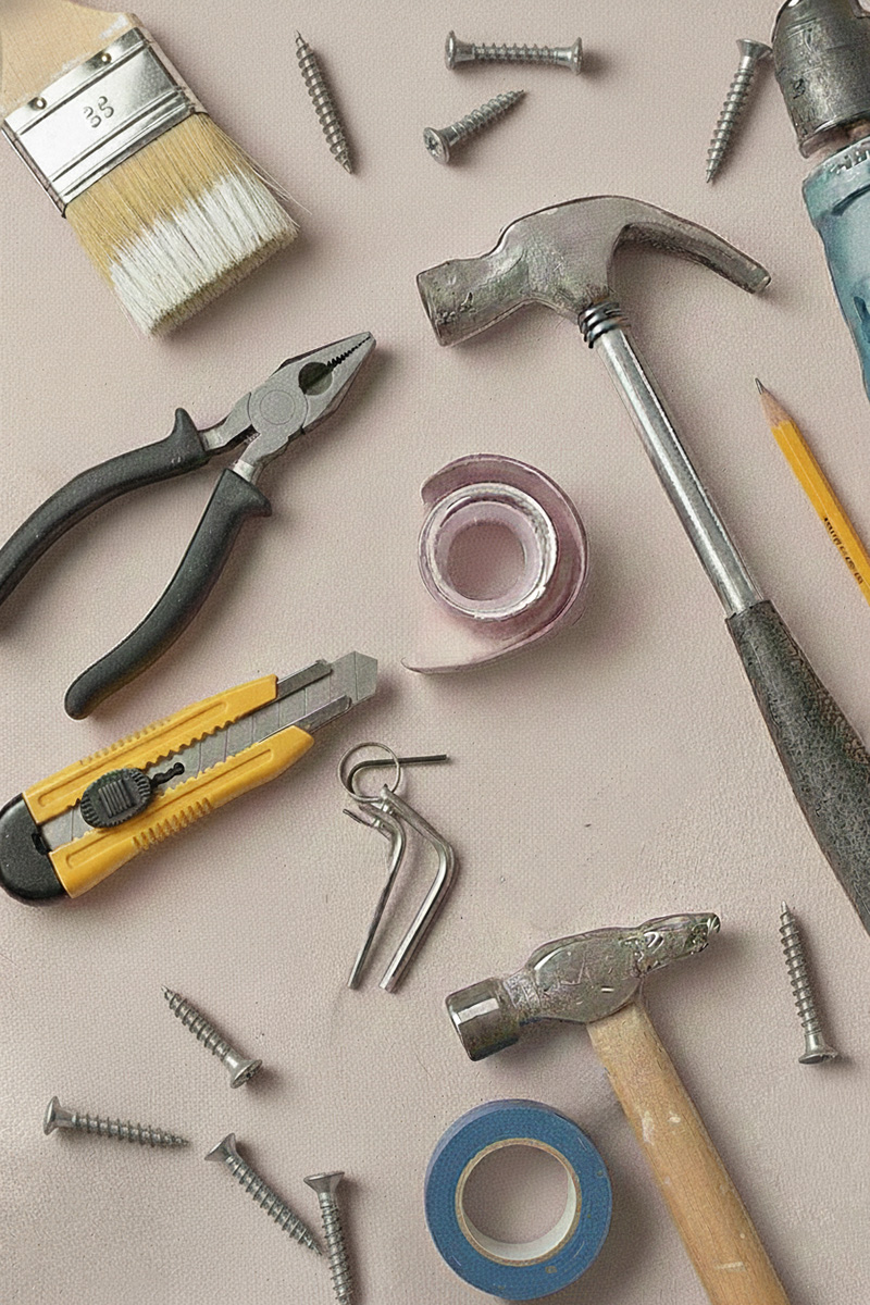 Hammers, cordless drill, screws, pencil, paintbrush