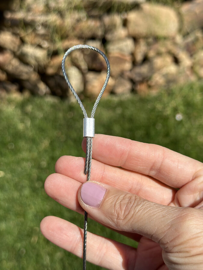 Looping wire through a metal crimp