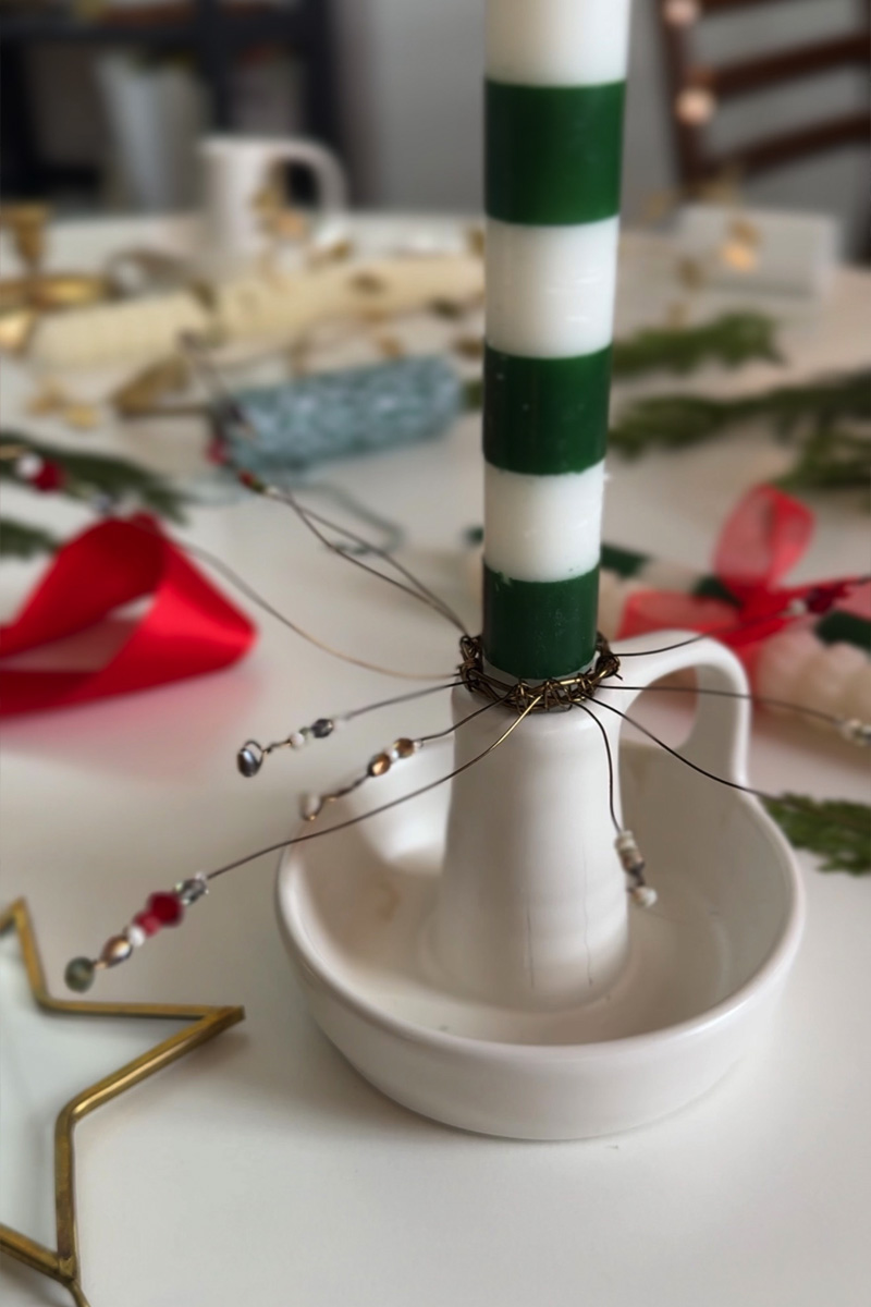 Green and white striped candles with a beaded cuff