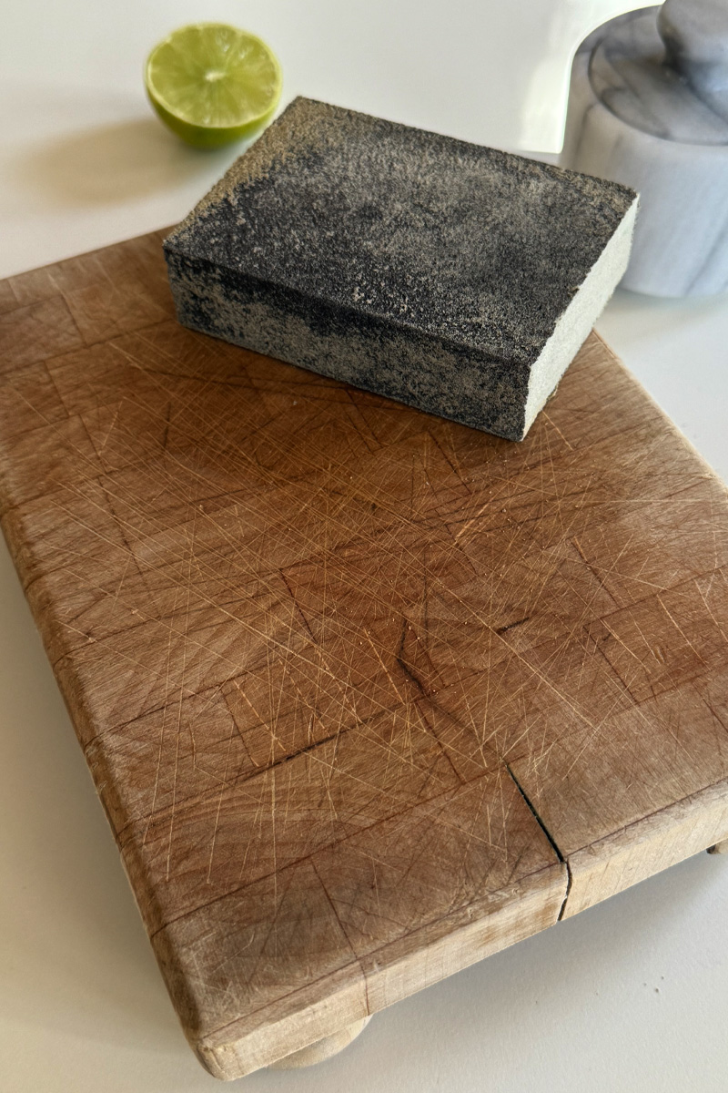 Sanding block on a wood cutting board