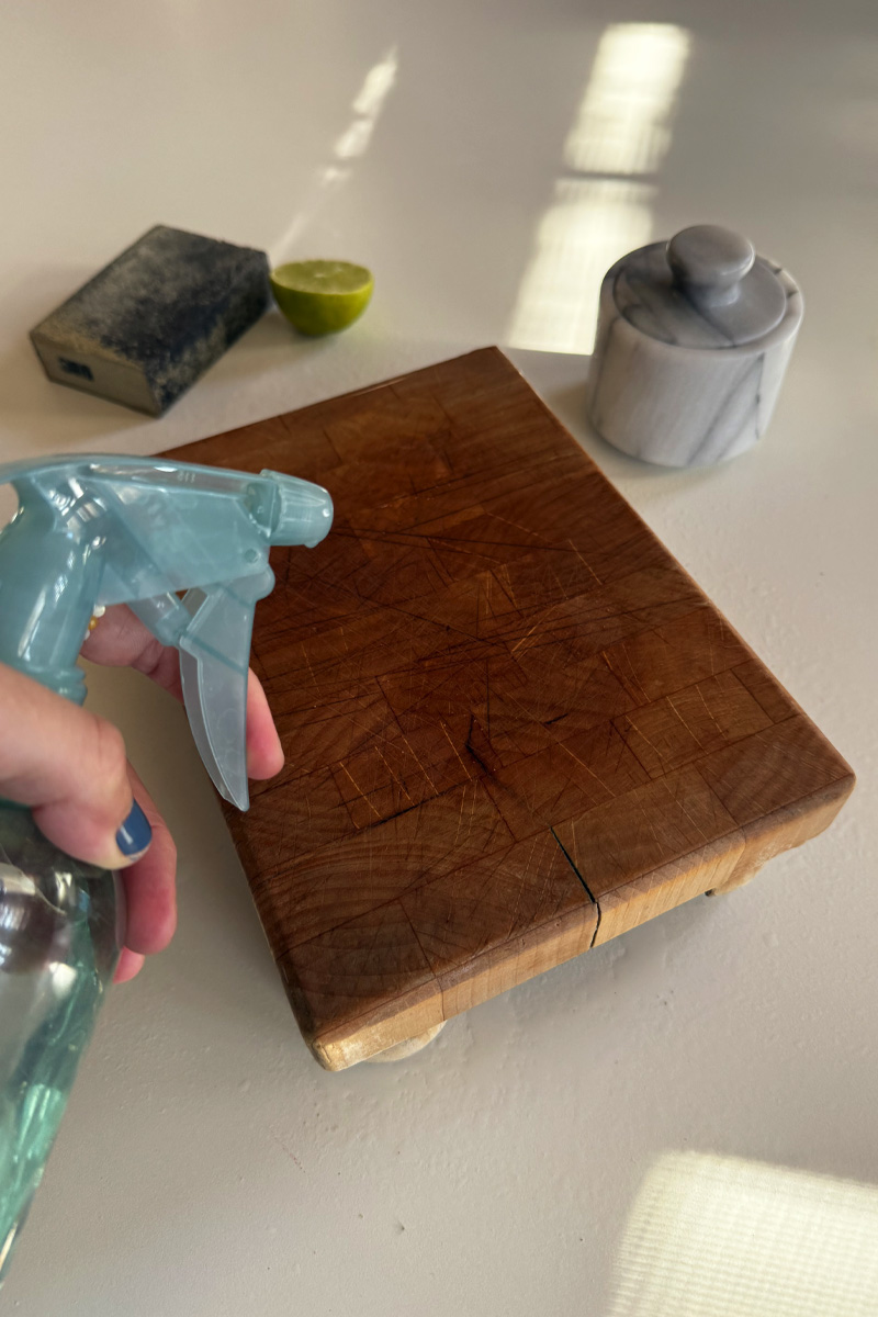 White Vinegar spray bottle on a wood cutting board